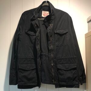 Levi’s women’s black canvas multi pocket jacket snaps and zipper closure L